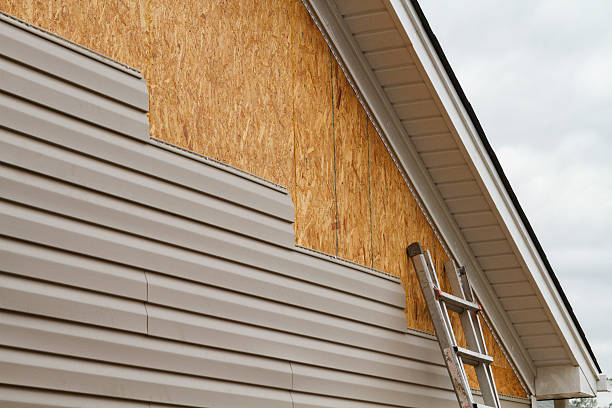Professional Siding Replacement technician working in Burton, OH